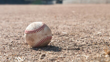 Close-up Of A Baseball On The Ground In A Ballpark, USA