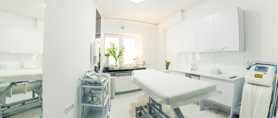 wide copy space shot presenting clean and bright treatment room at spa facility and aesthetic medici