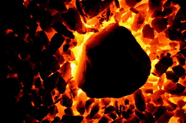 Poster - Texture of burning and inflaming coal of different sizes.