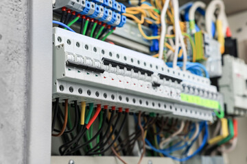 Electrical panel with many wires in fuse box, closeup