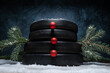 Heavy dumbbell barbell weight plates stacked on top of each other in the shape of a snowman. Healthy fitness lifestyle winter composition for Christmas. Gym workout sport training concept on a snow.