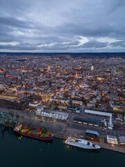 Wall Mural - Aerial view of Varna city port at sunset. Night urban landscape.