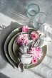 © RooM The Agency - Overhead view of a formal place setting decorated with pink chrysanthemum flowers