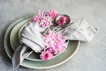 Close-Up Of A Formal Place Setting Decorated With Pink Chrysanthemum Flowers