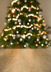 blurred background without focus with bokeh. christmas table background with christmas tree bokeh.