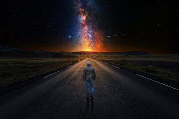 Wall Mural - lonely man walking down a long road