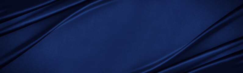 Navy blue silk satin. Silky shiny fabric. Dark luxury background with space for design. Banner. Wide. Long. Panoramic. Template. Empty. Flat lay, top view table. Beautiful.Elegant.Birthday,Christmas.