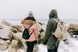 © Photocreo Bednarek - Couple trekking in winter by the sea.