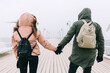 © Photocreo Bednarek - Couple walk in winter on jetty by the sea