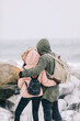© Photocreo Bednarek - Couple trekking in winter by the sea.