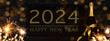 HAPPY NEW YEAR 2024 celebration background banner panorama long- Sparklers and champagne or sparkling wine bottle on rustic black wooden wall texture.