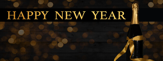 Aufkleber - HAPPY NEW YEAR 2024 celebration background banner panorama long- Champagne or sparkling wine bottle and golden bokeh lights  on rustic black wooden wall texture.