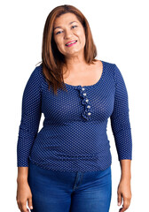Middle age latin woman wearing casual clothes looking positive and happy standing and smiling with a confident smile showing teeth
