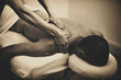 Grainy black and white art photo of bodywork massage therapy. 