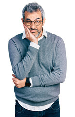 Sticker - Middle age hispanic with grey hair wearing glasses thinking looking tired and bored with depression problems with crossed arms.