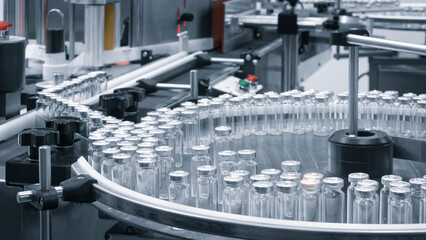 Poster - Pharmaceutical industry. Production line machine conveyor with glass bottles ampoules at factory. Pharmaceutical industry concept background.