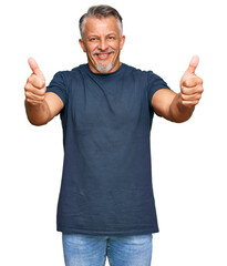 Poster - Middle age grey-haired man wearing casual clothes approving doing positive gesture with hand, thumbs up smiling and happy for success. winner gesture.