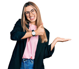 Canvas Print - Hispanic young woman wearing business jacket and glasses showing palm hand and doing ok gesture with thumbs up, smiling happy and cheerful