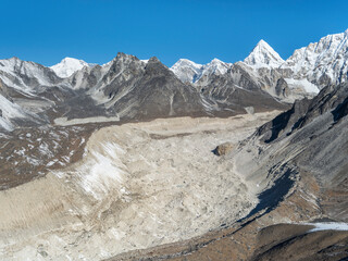 Wall Mural - Path of great glacier with view to triangle peak Pumori in valley Khumbu in Nepal