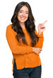 © Krakenimages.com - Beautiful brunette young woman wearing casual orange sweater smiling happy pointing with hand and finger to the side
