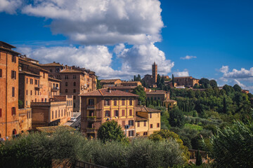 Wall Mural - Beautiful panoramic view of the historic city of Siena at daytime with an amazing cloudscape on an idyllic autumn evening, Tuscany, Italy. October 2022