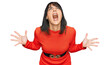 © Krakenimages.com - Young hispanic woman wearing casual clothes crazy and mad shouting and yelling with aggressive expression and arms raised. frustration concept.
