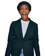 Sticker - Young african american girl wearing business clothes angry and mad screaming frustrated and furious, shouting with anger. rage and aggressive concept.