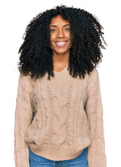 Young african american girl wearing casual clothes with a happy and cool smile on face. lucky person.