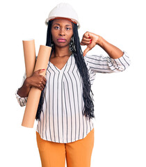 Sticker - Young african american woman wearing architect hardhat holding blueprints with angry face, negative sign showing dislike with thumbs down, rejection concept