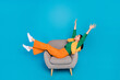© deagreez - Full size profile portrait of overjoyed glad girl sit chair raise hands isolated on blue color background