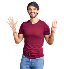 Poster - Handsome hispanic man wearing casual clothes showing and pointing up with fingers number eight while smiling confident and happy.