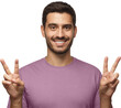 © Damir Khabirov - Young man with optimistic smile, showing victory gesture with both hands, V sign