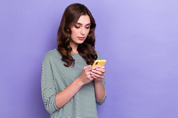 Poster - Photo of young addicted wavy hair lady hold iphone pro max chatting with her boss app for gadget empty space isolated on purple color background