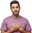 © Damir Khabirov - Kind hearted friendly nice guy shows kindness, wearing blue t-shirt. Smiling positive young man keeps hands on chest, expresses sympathy