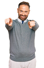 Poster - Handsome middle age man wearing business clothes pointing to you and the camera with fingers, smiling positive and cheerful