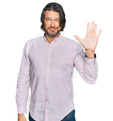 Sticker - Middle age handsome man wearing business shirt showing and pointing up with fingers number five while smiling confident and happy.