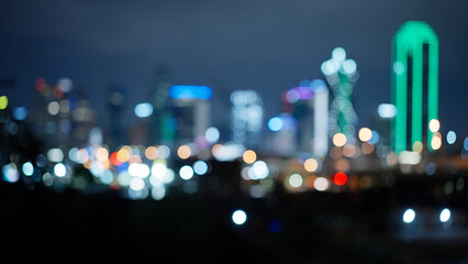 Wall Mural - Blurred background of Dallas Texas skyline by night - travel photography