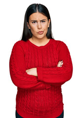 Poster - Beautiful brunette woman wearing casual sweater skeptic and nervous, disapproving expression on face with crossed arms. negative person.