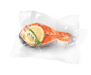 Wall Mural - Salmon with lemon in vacuum pack on white background, top view