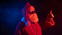 Portrait Of Santa Claus In Sunglasses In Neon Light.