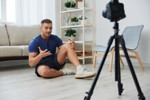 Man Athlete Blogger Records Exercise Training On The Body At Home On Camera, Sports Blogger Bodybuilder, The Concept Of Health And Beauty