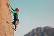 © zhukovvvlad - the girl is engaged in rock climbing. sports in nature.
