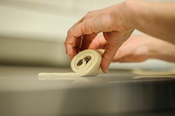 Canvas Print - Closeup of hands making dessert in a bakery