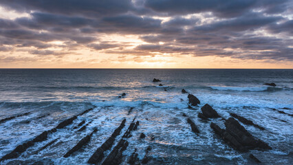 Wall Mural - Gorgeous vibrant aerial drone landscape sunset image of Welcombe Mouth Beach in Devon England