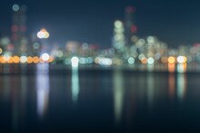 Bokeh Cityscape View With Illuminated Buildings At Late Night