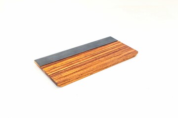 Closeup of a natural wooden cutting board isolated on the white background