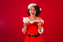 Beautiful Black Brazilian Woman, Dressed As Santa Claus, Mama Claus, Holding Piggy Bank And Coin