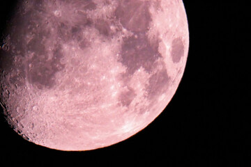 moon at night sky. sharp footage of full moon with telephoto lens close-up. pink moon shot from grou
