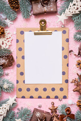 Wall Mural - Blank paper on tablet with frame made frome pine tree branches and Christmas decoration in snow top view