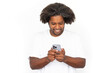 © KAMPUS - Joyful African American man using phone. Excited mature male model with dark curly hair in white T-shirt smiling, texting on smartphone. Modern technology, advertising concept